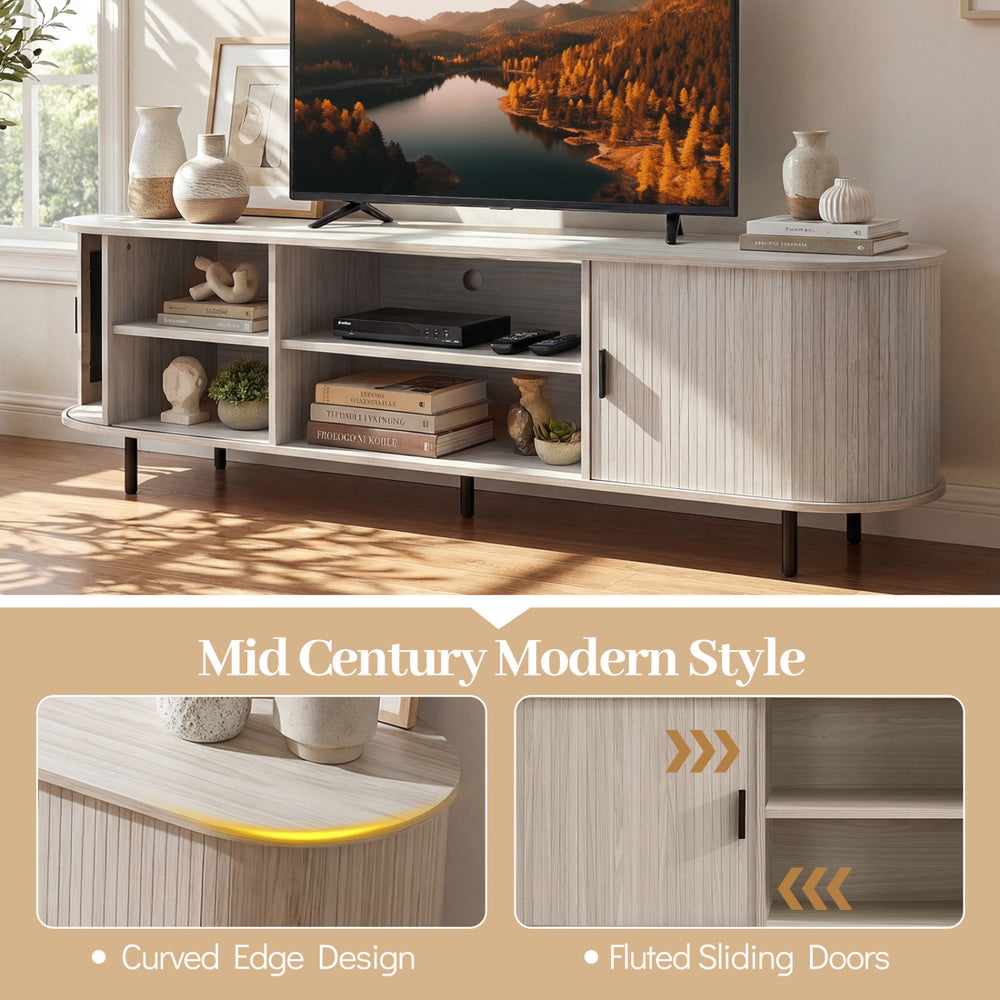 Mid century modern TV stand with fluted sliding doors, curved edges, and ample storage for TVs up to 80 inches.