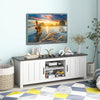 Side view of the TV stand in black, showcasing its sturdy design with two cabinets and open shelves for stylish storage.