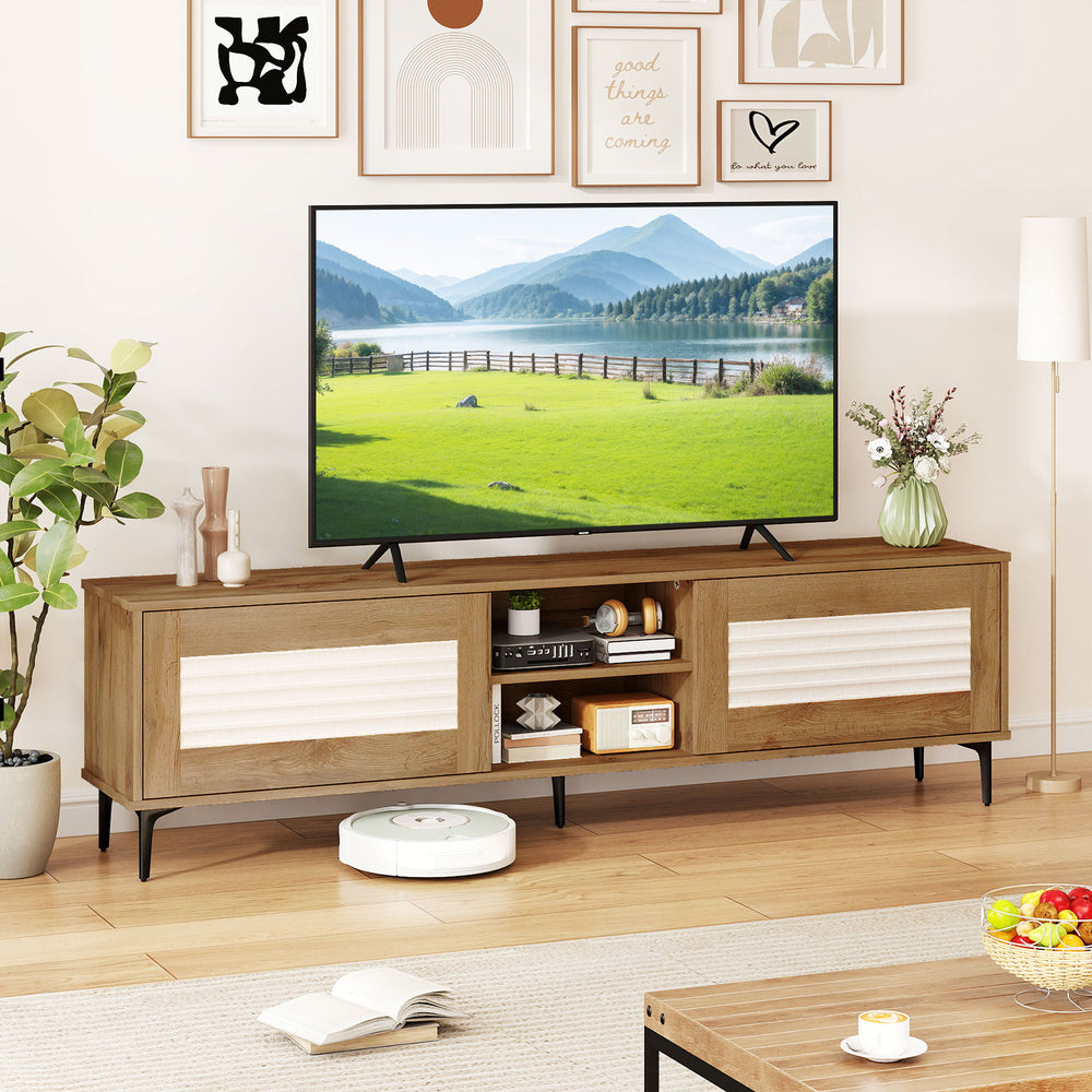 Oak TV stand with soft close hinges and fluted doors, featuring 2 cabinets and open shelves for media storage.