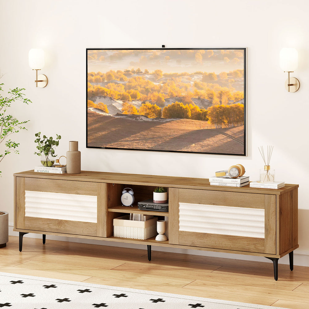 TV stand with waveform fluted doors in oak, supporting TVs up to 70 inches, featuring open shelves and concealed.