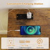 Charging station with two outlets and USB ports on a brown TV stand, ideal for organizing devices and cables.