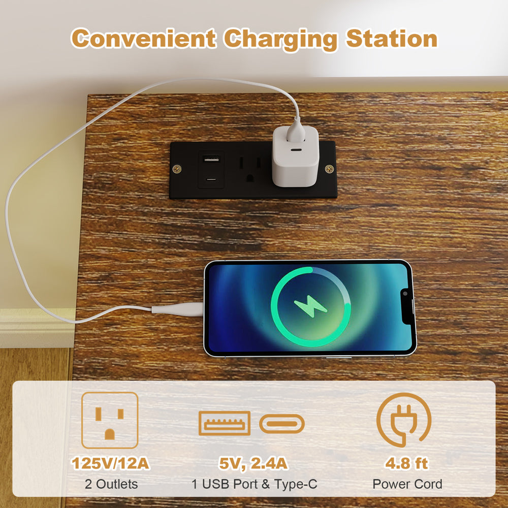 Charging station with two outlets and USB ports on a brown TV stand, ideal for organizing devices and cables.