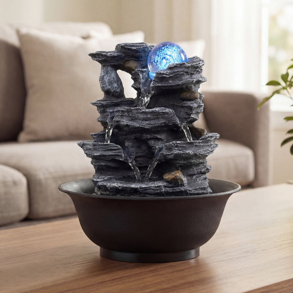 Tabletop water fountain featuring multiple tiers, a rolling crystal ball, and color-changing LED light for tranquil.