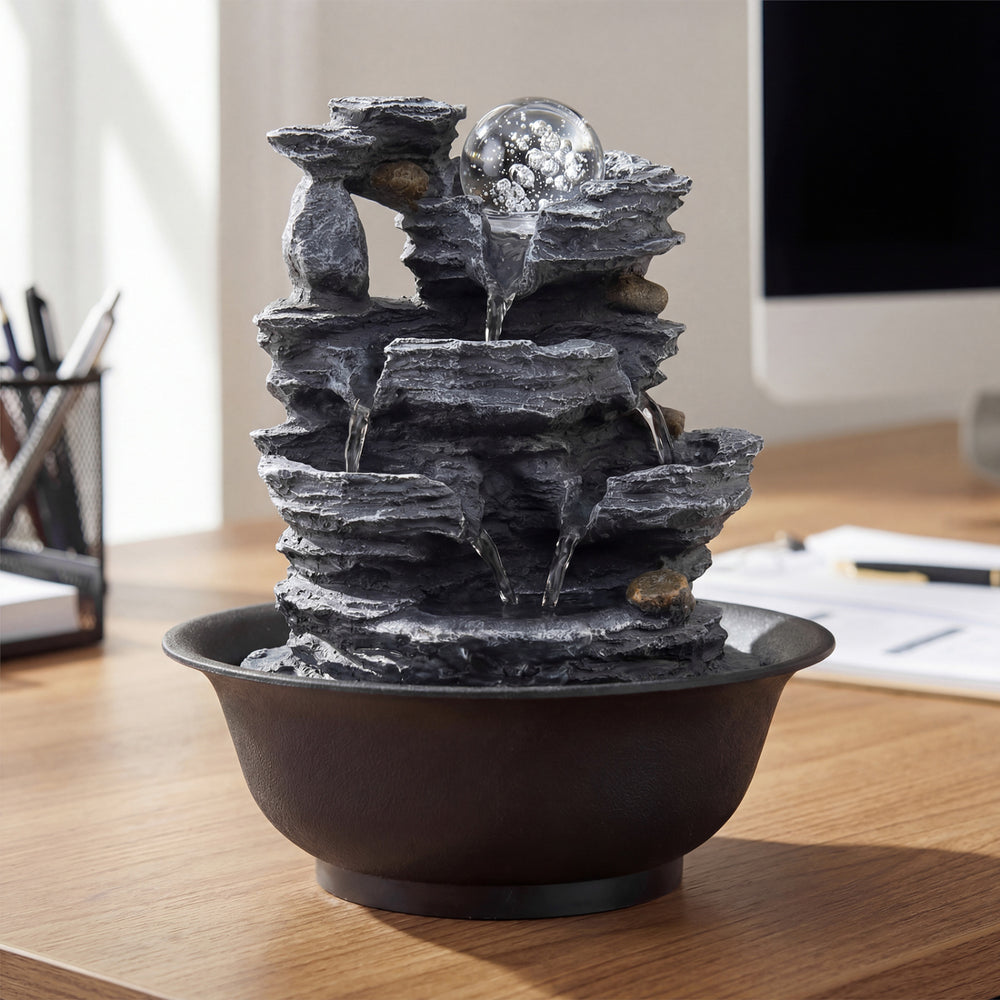 Tabletop water fountain with multiple tiers, rolling crystal ball, and color-changing LED light for tranquil desk.