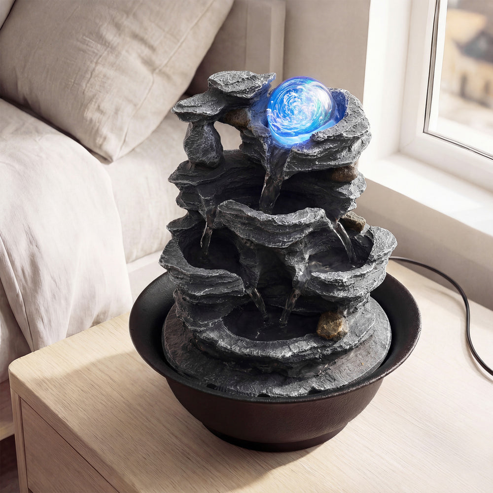 Tabletop water fountain showcasing the serene tiered design and tranquil water flow, perfect for compact spaces.