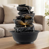 Tabletop water fountain with LED light, featuring a multi-tiered design for a calming indoor ambiance.