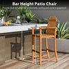 Tall Adirondack chair with armrests and footrest, made of acacia wood, ideal for 40"-43" bar tables on patios or decks.