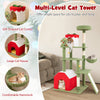 Multi-level green cat tower with gift-shaped condo, sisal scratching posts, and plush top perch for playful lounging.