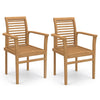 Set of 2 teak wood dining chairs with slatted seats and inclined backrests, shown at an angle for backyard dining.