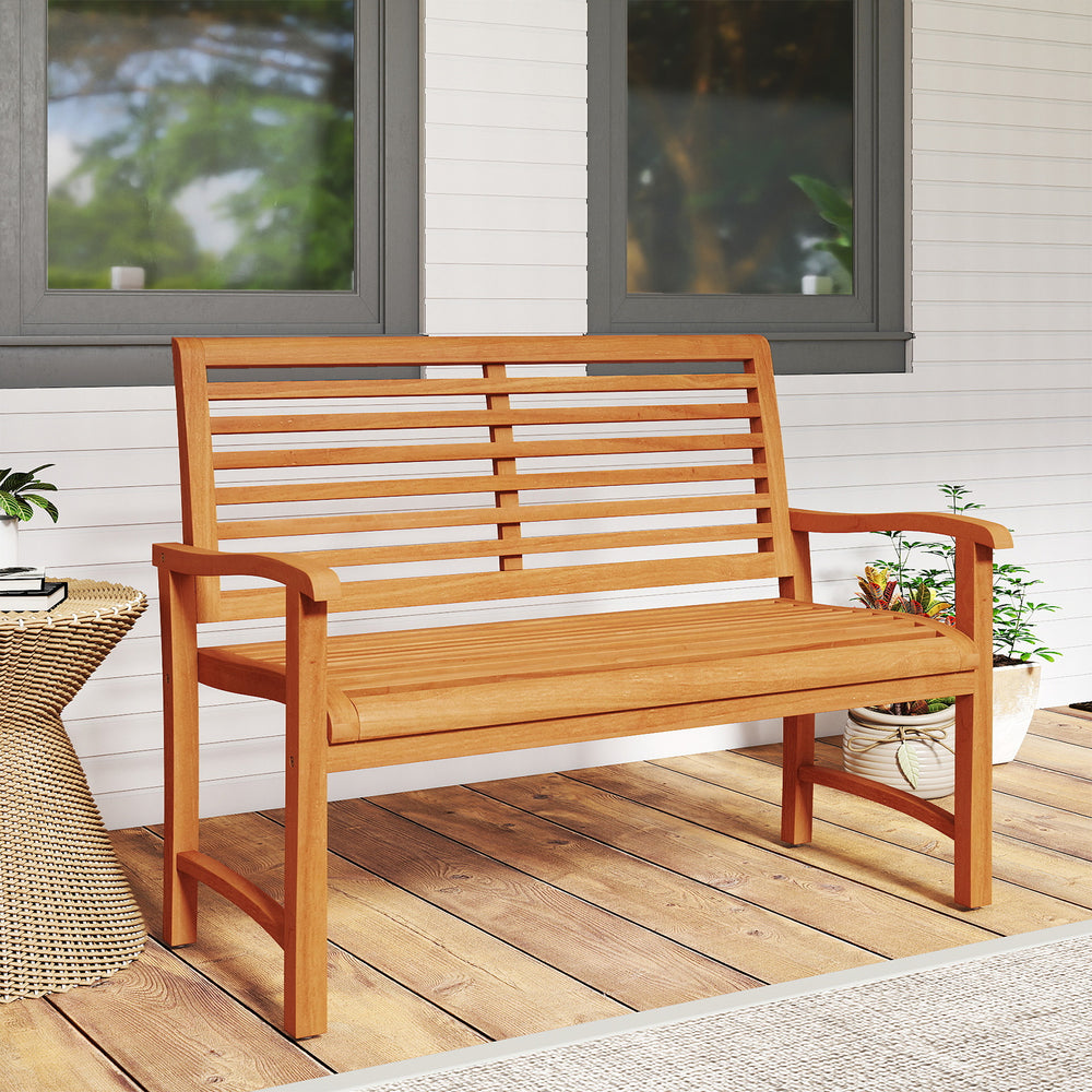 Teak wood outdoor garden bench with slatted backrest, sturdy construction, suitable for patio or garden use.