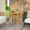 Teak wood outdoor patio nesting tables in a natural finish, perfect for versatile arrangements in backyard or living.