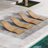 Four teak wood patio folding chaise lounge chairs arranged poolside, featuring slatted seats for outdoor relaxation.