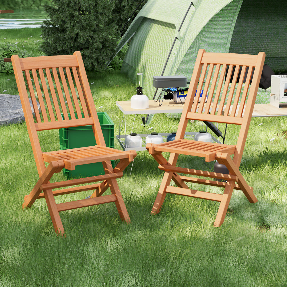 Teak wood folding dining chairs with slatted seats, perfect for camping or backyard relaxation.