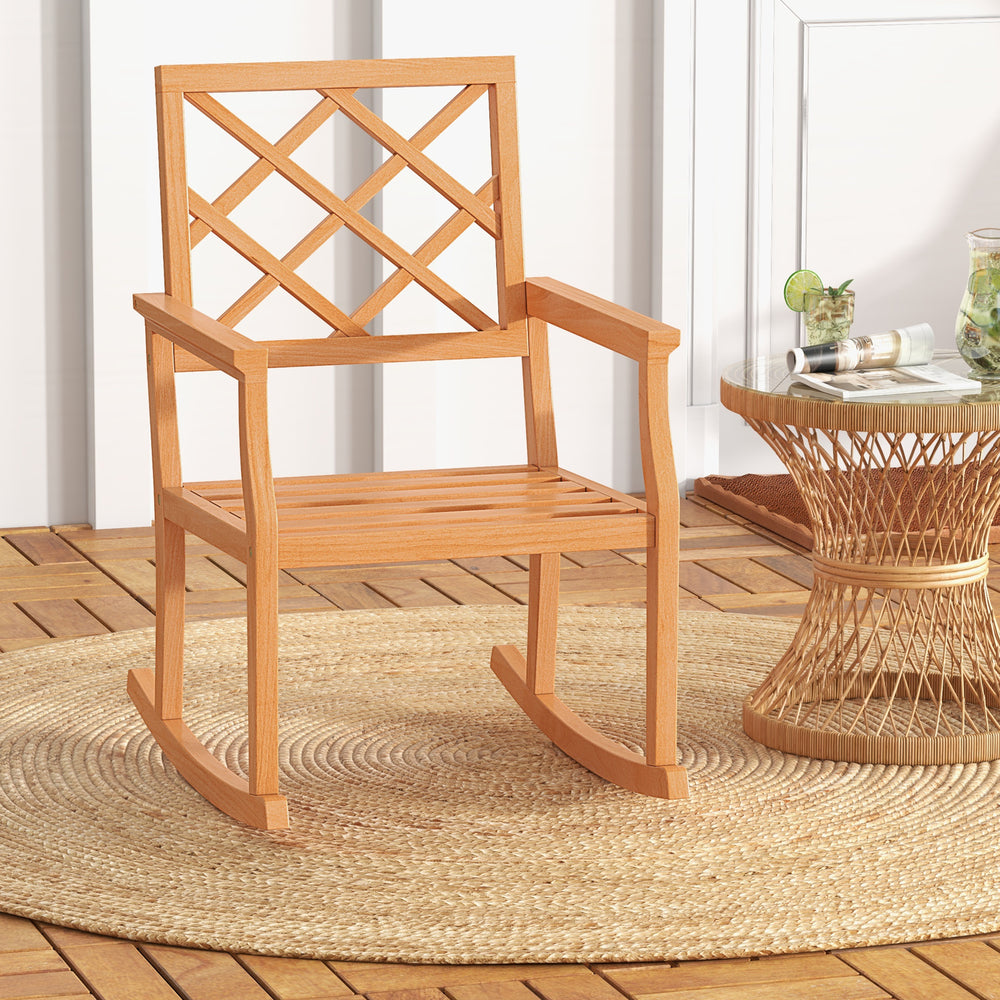 Teak wood rocking chair with slatted seat and backrest, perfect for outdoor relaxation on the patio or porch.