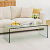 Clear tempered glass coffee table with minimalist design, ideal for living room or office use, showcasing a tidy.