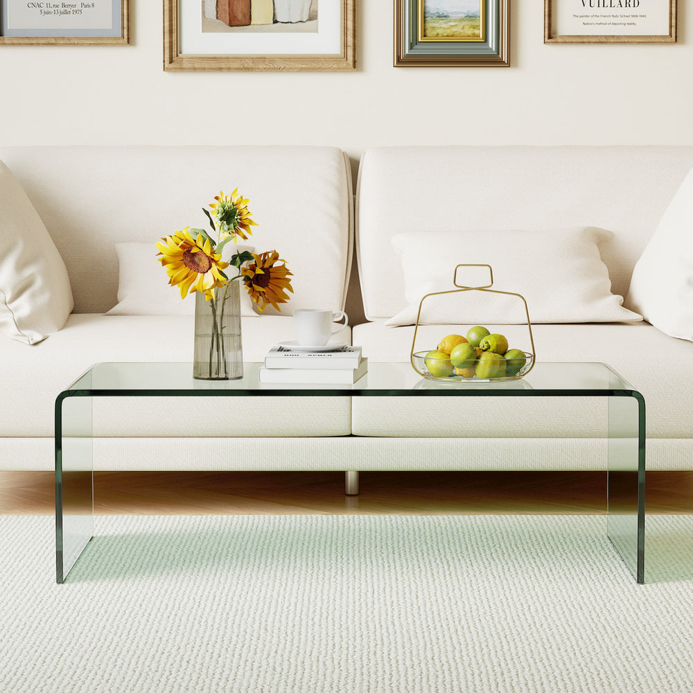 Clear tempered glass coffee table with minimalist design, perfect for living room or office use, showcasing elegant.
