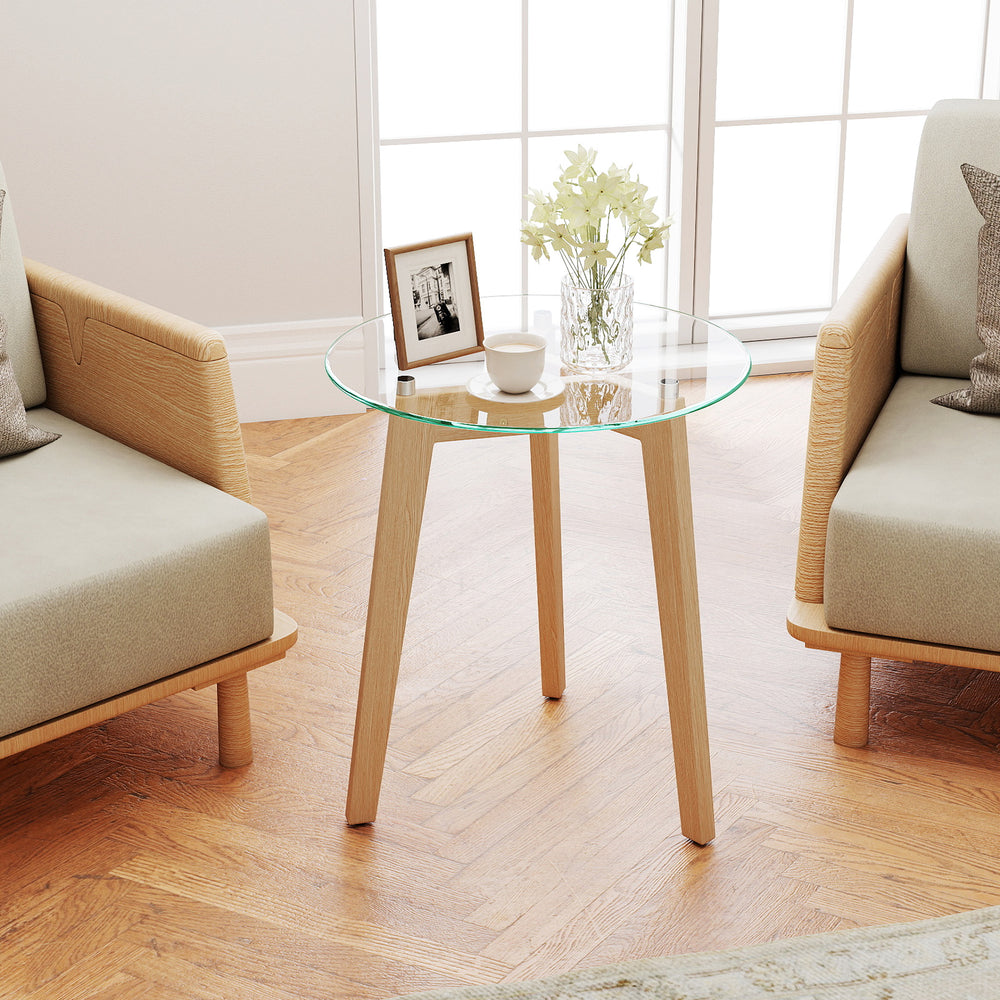 Round tempered glass end table with solid rubber wood legs, perfect for living room or bedroom use.