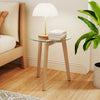Tempered glass end table with solid rubber wood legs, featuring anti-slip aluminum discs for enhanced stability and.