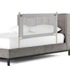 Toddler bedrail in gray with side pocket, featuring 24 adjustable heights for safety and convenience on various bed.