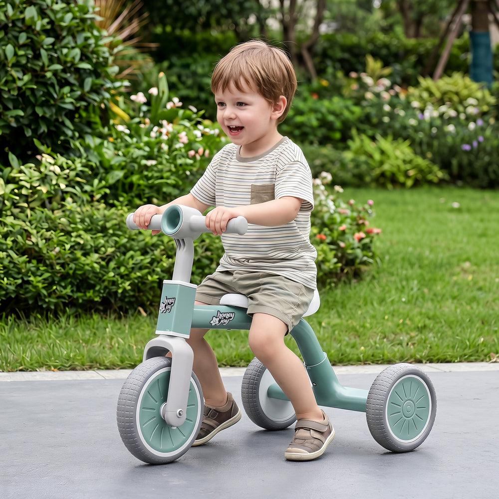 Toddler convertible trike in green with a carbon steel frame, designed for stability and safety, perfect for outdoor.