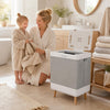 Towel warmer bucket with built-in rack for organized storage, quick heating, and auto shut-off for safety in bathrooms.