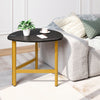 Triangle coffee table with black top and yellow metal legs, ideal for versatile use in living spaces.