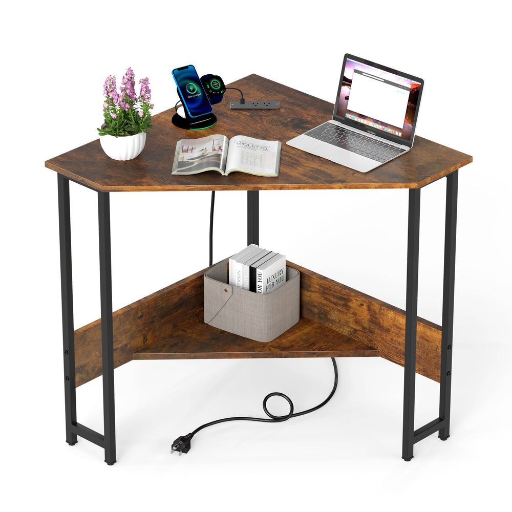 Triangle computer corner desk in rustic brown with charging station, open shelf, and sturdy steel legs for small spaces.