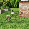 Tricycle plant stand in bronze with three hollowed baskets, ideal for indoor or outdoor floral display.