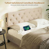 Tufted upholstered camelback headboard in beige with 2 AC outlets, designed for queen and full size beds.
