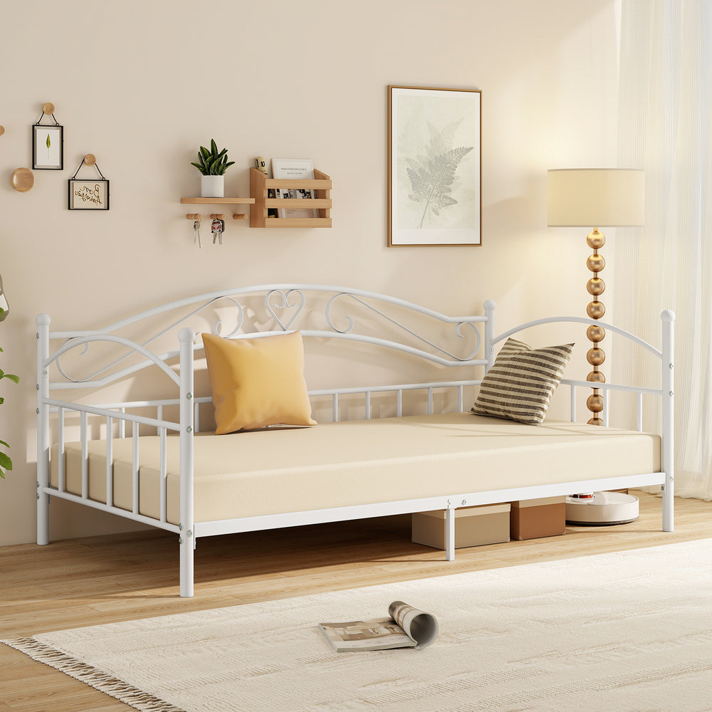 Twin size metal daybed frame in white with heart-shaped decoration, perfect for bedroom seating and extra sleeping.