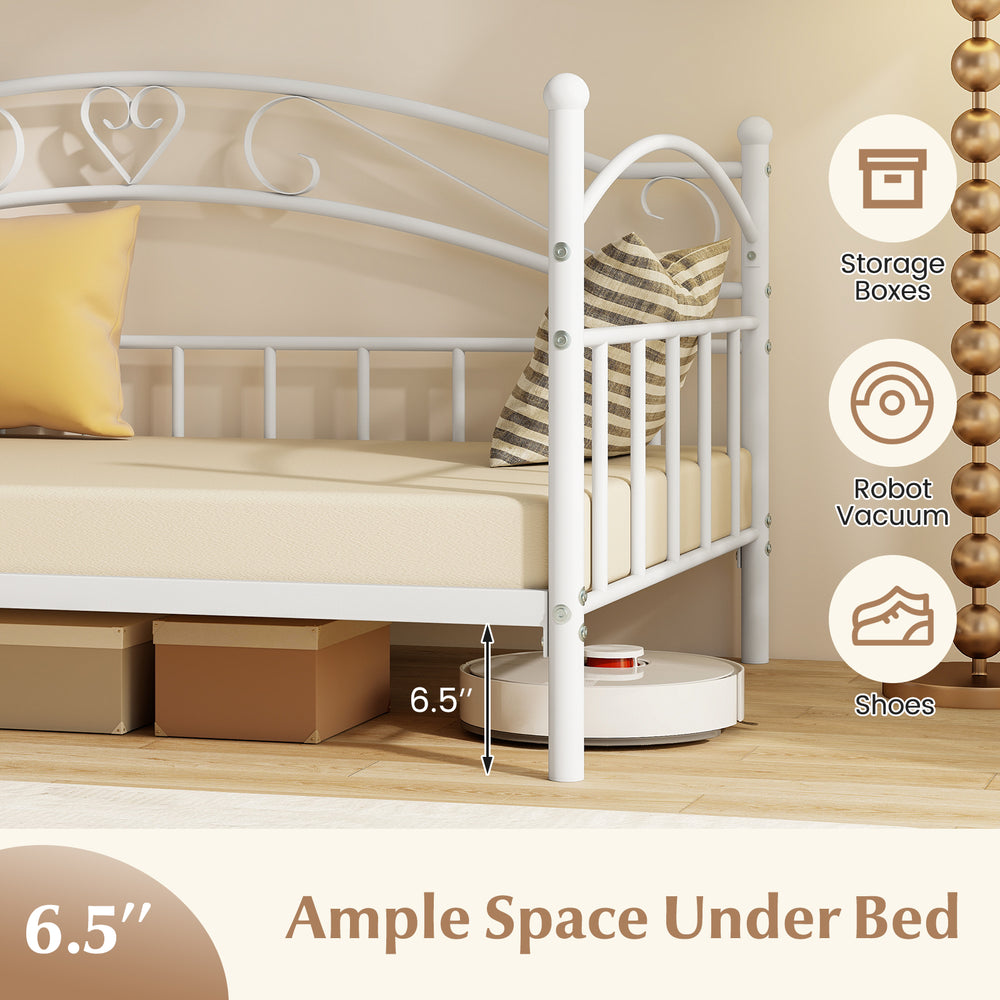 Twin size metal daybed frame in white with ample under-bed space for storage boxes and robot vacuum.