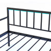 Close-up of the black twin daybed's curved guardrails and metal slats, featuring LED lights and a charging station.