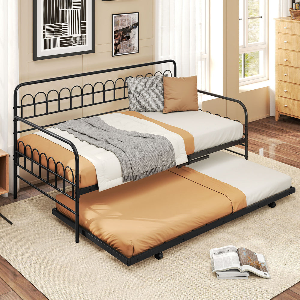 Twin daybed in black with curved backrest and armrests, showcasing a cozy setup ideal for living room or guest room use.