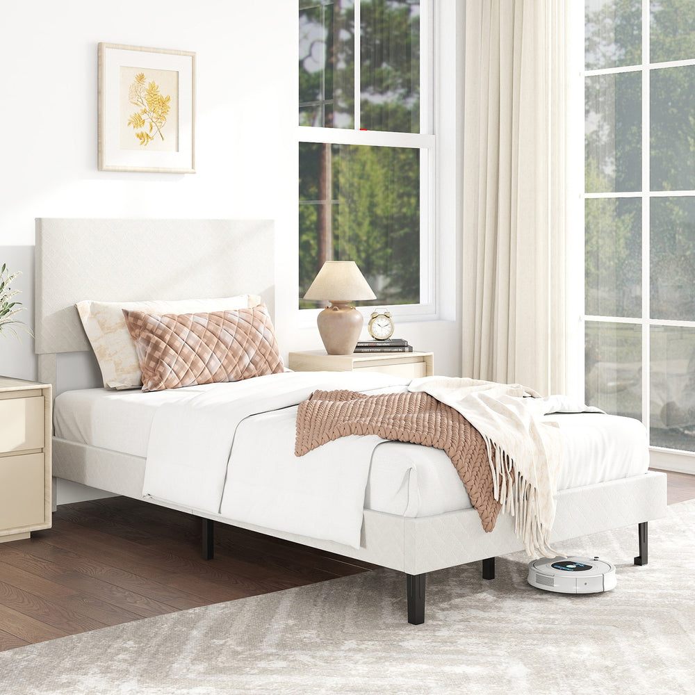 Beige twin size upholstered platform bed frame with chevron headboard, featuring a modern design and ample under-bed.