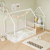 Twin house floor bed frame in white with storage shelf, designed for Montessori-style independence and safety for kids.