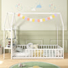 Twin house floor bed frame in white with storage shelf, designed for kids' independence and safety in a stylish bedroom.
