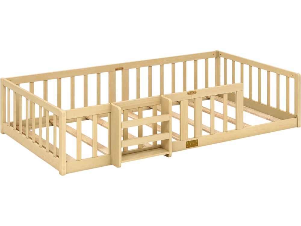 Twin Montessori floor bed with bookshelf door, natural wood guardrails and plywood crossbars shown from an angled view.