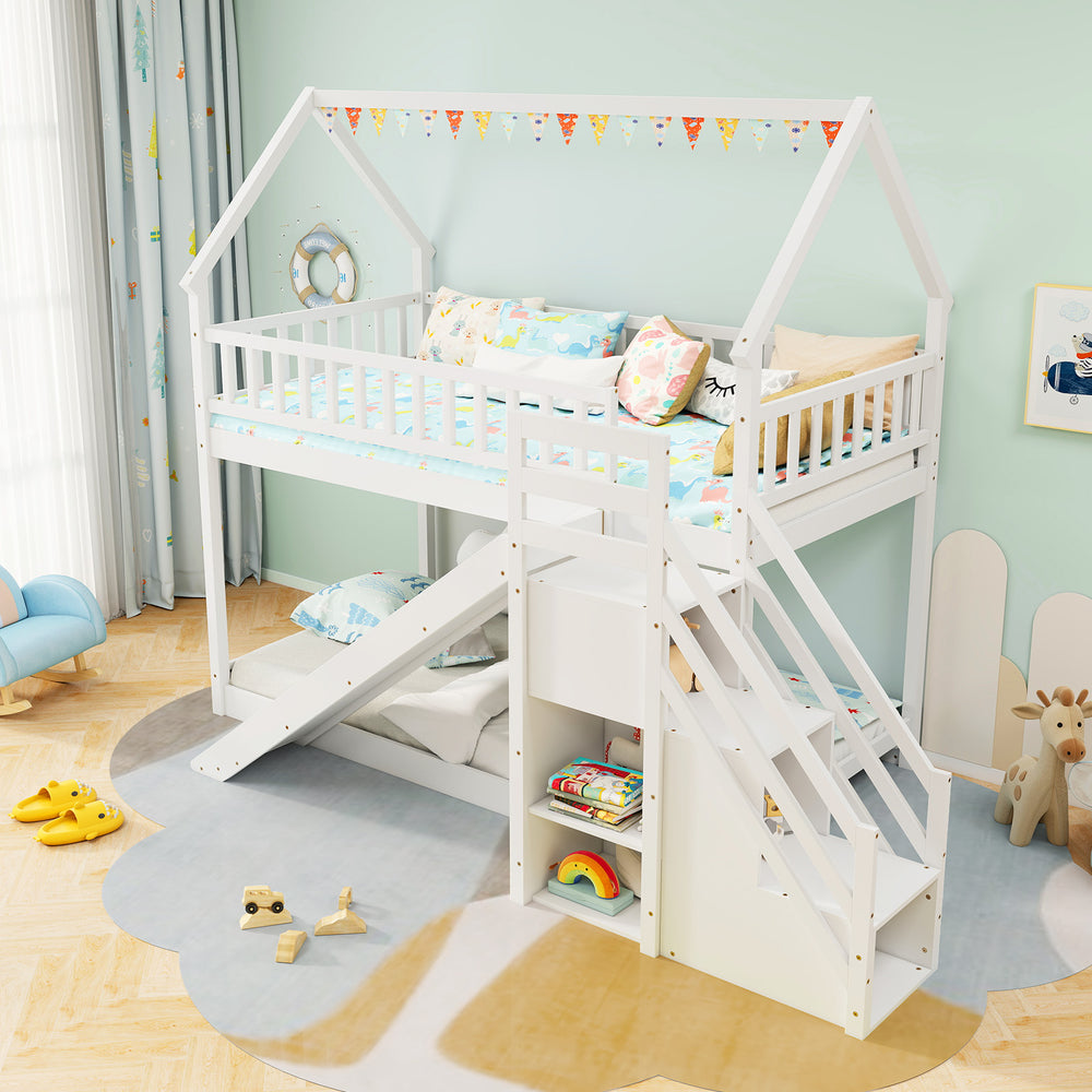 Twin over twin bunk bed in white with slide, staircase, and house-shaped frame for fun and functional bedroom storage.