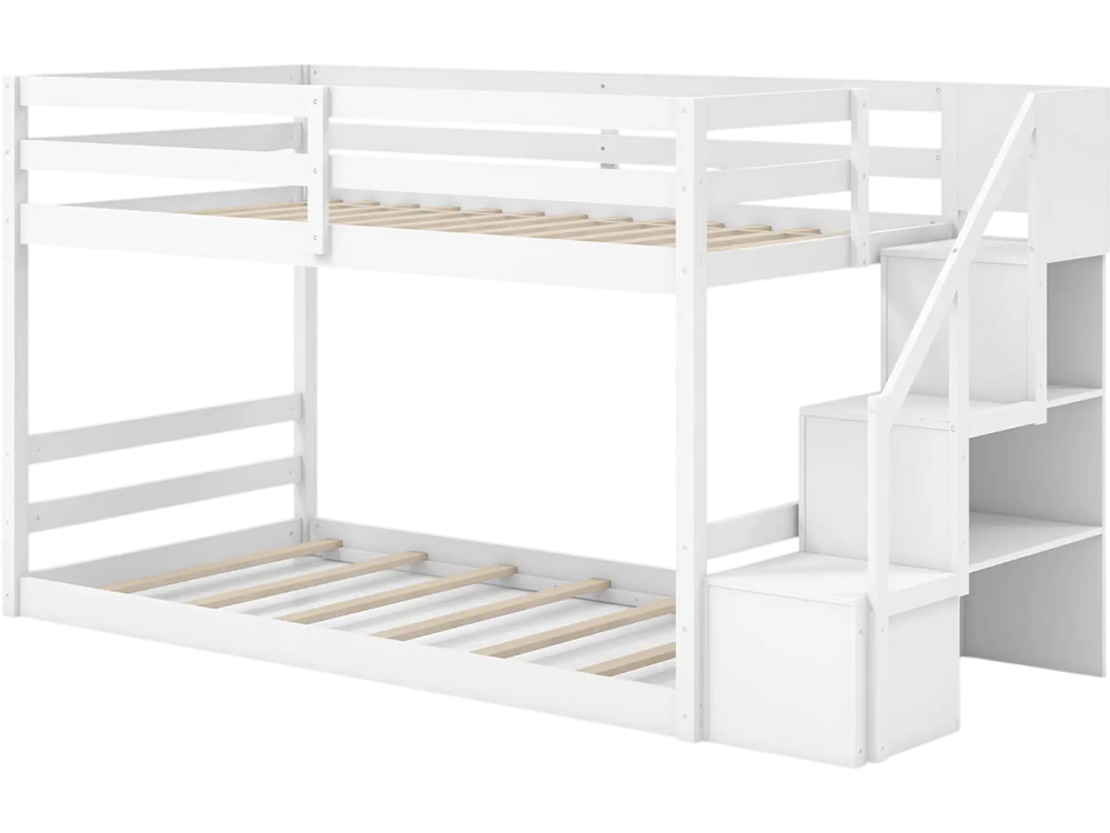 Twin over twin low bunk bed in white with storage stairs and open compartments for organized kids' rooms.