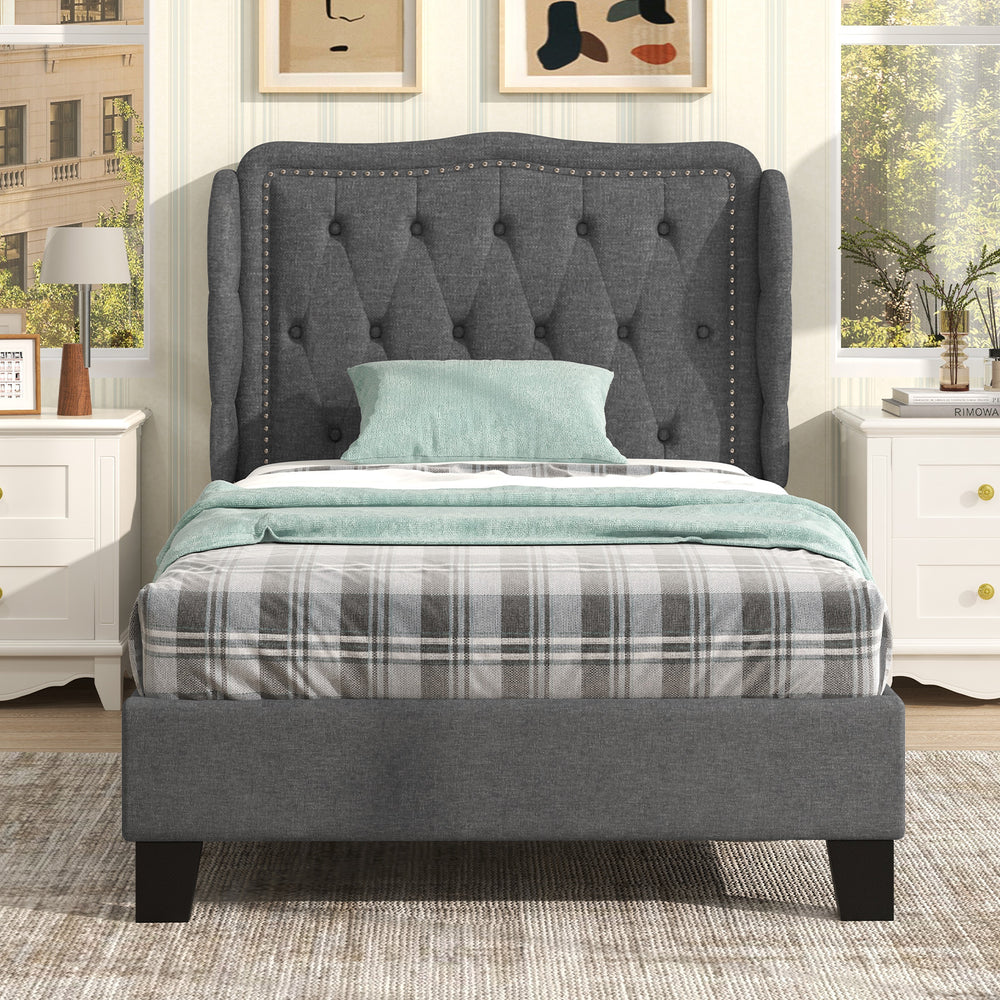 Twin size bed frame with gray button tufted wingback headboard and under-bed storage, perfect for cozy bedroom setups.
