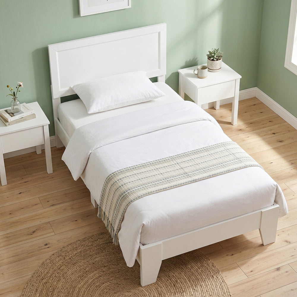 Twin size bed frame in white with headboard, featuring wooden slats and ample under-bed storage for small rooms.