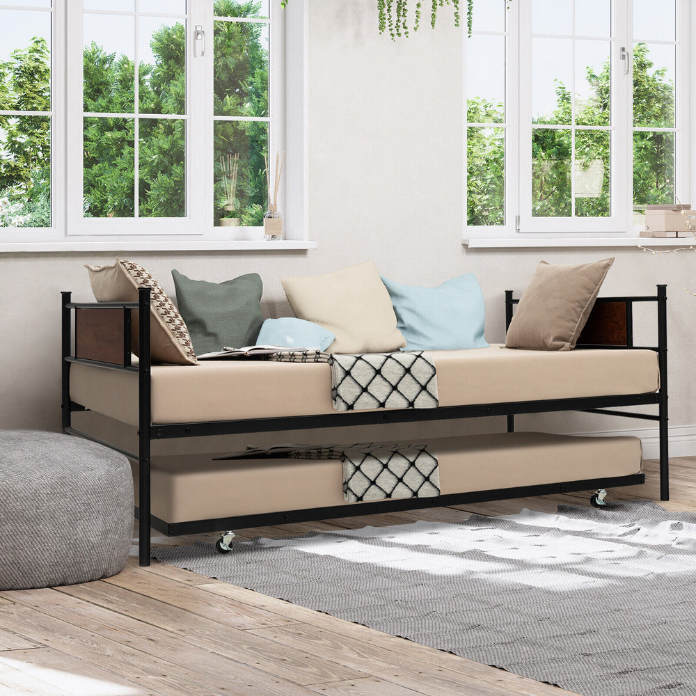 Twin size daybed frame with pullout trundle, featuring a sturdy steel structure and cozy cushions for versatile use.