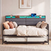 Twin size daybed with trundle in rustic brown, showcasing the upholstered headboard with multiple device charging.