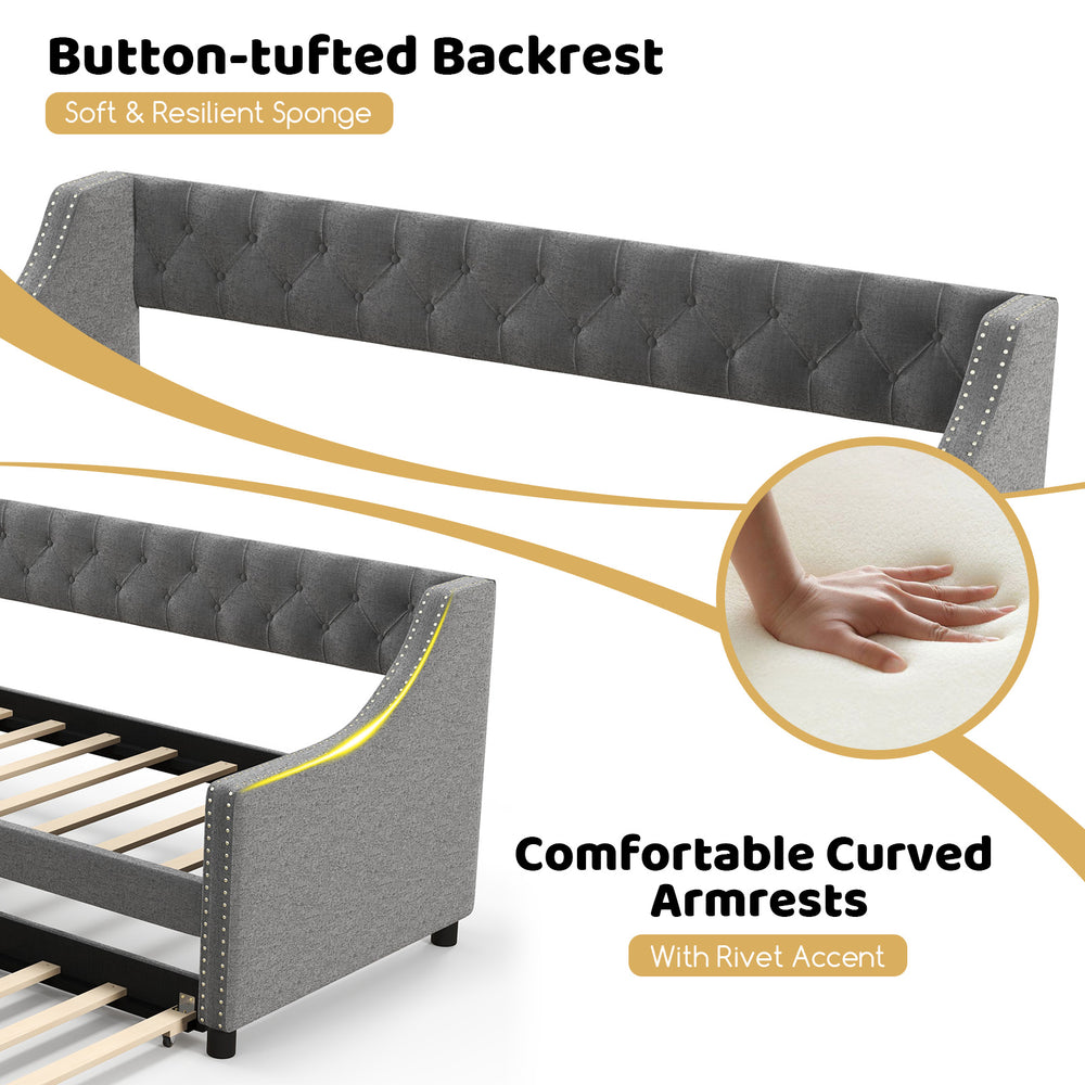 Curved armrests and button-tufted backrest of the gray twin size daybed with trundle, designed for style and comfort.