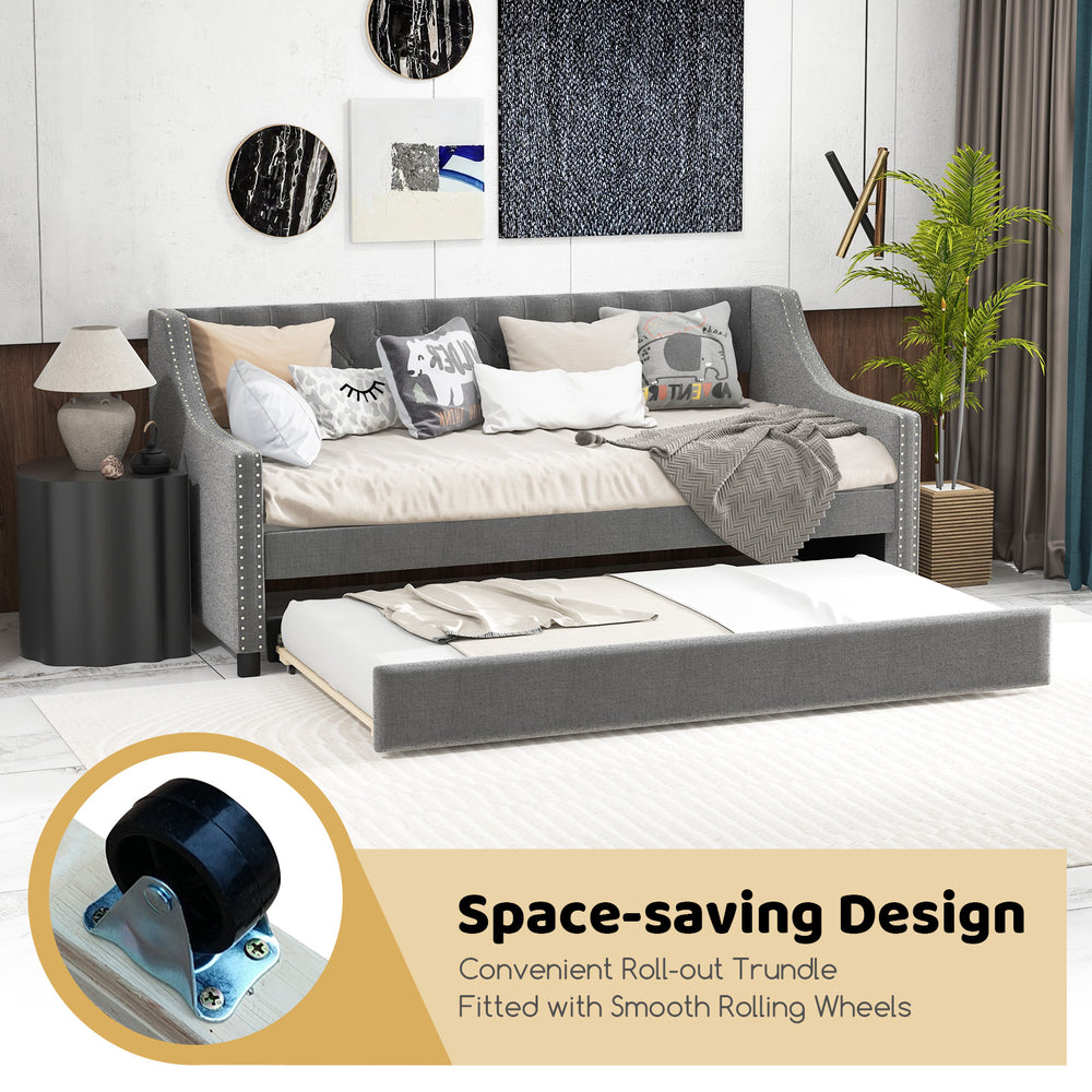 Twin size gray daybed with trundle, featuring curved armrests and smooth rolling wheels for space-saving convenience.