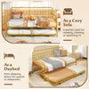Twin size golden metal daybed with trundle and lockable wheels, ideal for accommodating guests in living rooms or bedrooms.