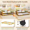Twin size golden metal daybed with pull-out trundle and lockable wheels, ideal for maximizing space in guest rooms.