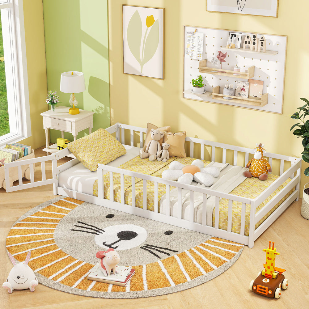 Twin size kids wood Montessori floor bed in white with fence and door, ideal for sleeping and playing in a cozy room.
