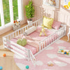 Twin size white Montessori floor bed with fence and door, designed for kids' safety and cozy play or sleep space.