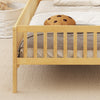 Twin size kids Montessori bed with natural pine wood frame, house-shaped headboard, and built-in storage shelf.